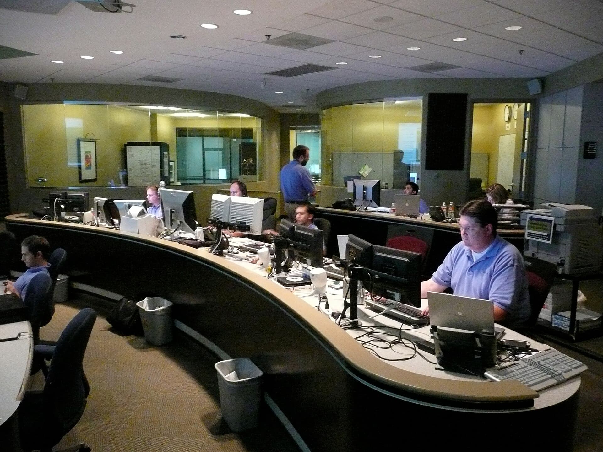 IT engineers collaborating at a network operations center